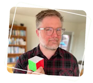 Spectrum's founder Ben holding a Rubrics Cube
